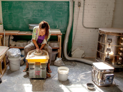 Brooke Winfrey works at her former studio in Brooklyn.jpg